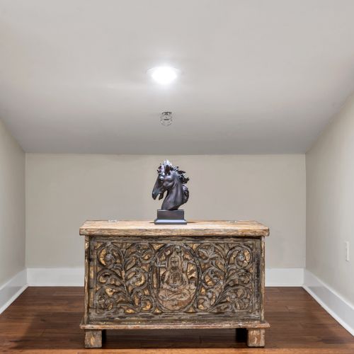 Bonus room with a hand-carved accent chest