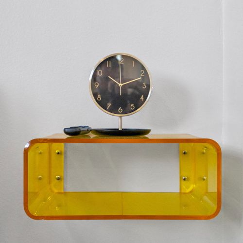 Fun retro touch w/ a bold yellow console & statement wall clock