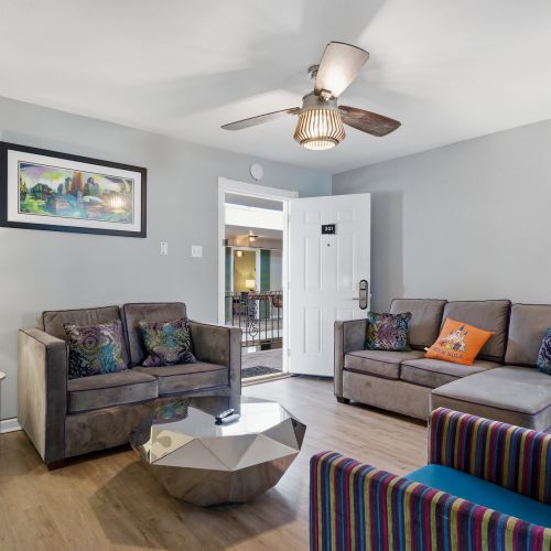Airy living room w/ a welcoming layout right from the entryway.