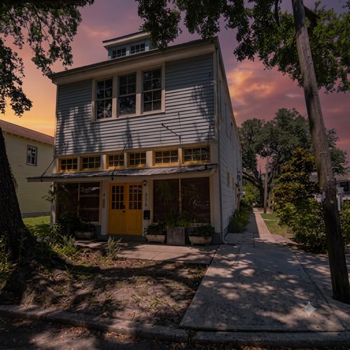 Sun-soaked building exterior nestled in a lively neighborhood.