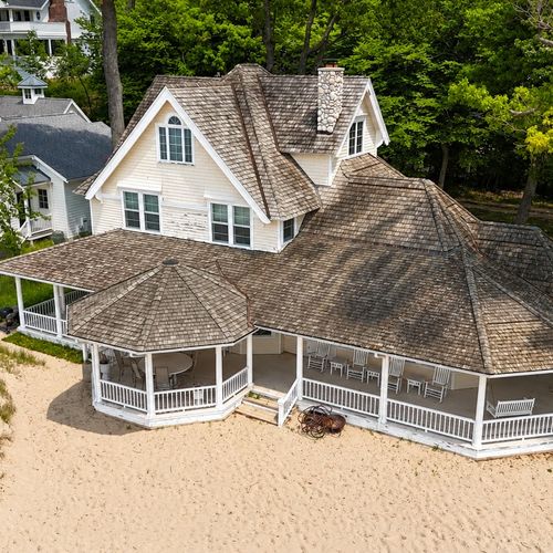 EXTERIOR:  Another aerial view of the house, highlighting the 3 stories of the house.