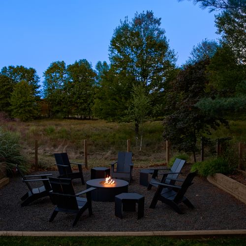 Evenings are exquisite by the propane fire pit, steps from the pool deck.