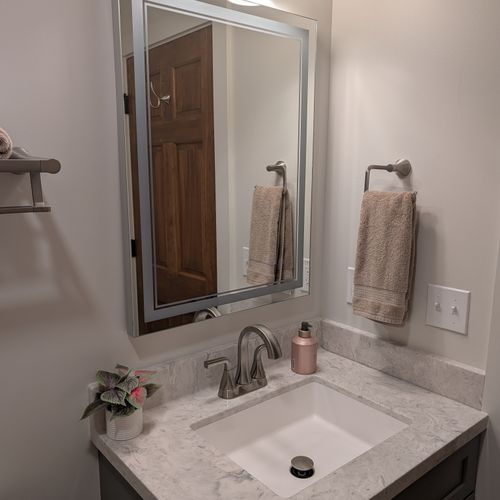 BATHROOM #3 (FIRST FLOOR):  Full bathroom on the first floor with a combination tub and shower.