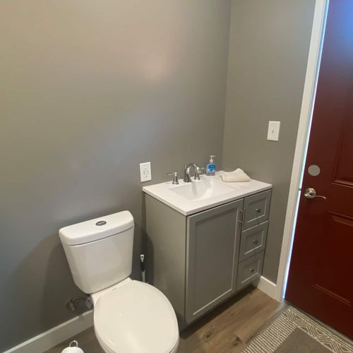 BATHROOM #2:  Full bathroom with a walk-in shower, toilet, sink, vanity, and mirror.