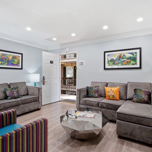 Bright, open living area with cozy seating & a welcoming vibe.