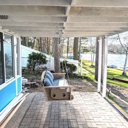 PATIO:  The fun swing on the patio below the deck.  Includes great view of Bass Lake.