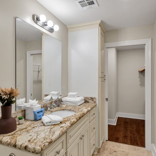 Fresh flowers and granite at the vanity