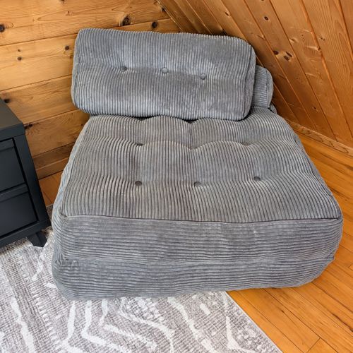 LOFT (THIRD FLOOR):  The home has a very cute top floor loft area with a king size bed, fold-out bed, chairs, nightstands, lamps, mirror, dresser, clothing rack, and a television.