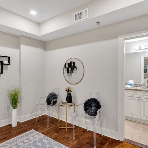 Chic landing with velvet seating and mirror decor