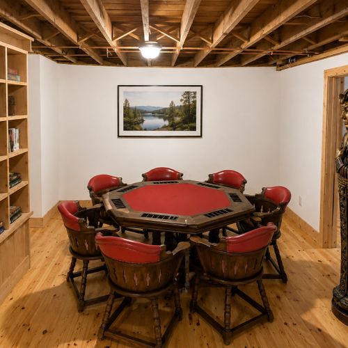 BASEMENT:  The home has a partially finished basement with a pool table, card table, bar, bedroom, and a full bathroom.