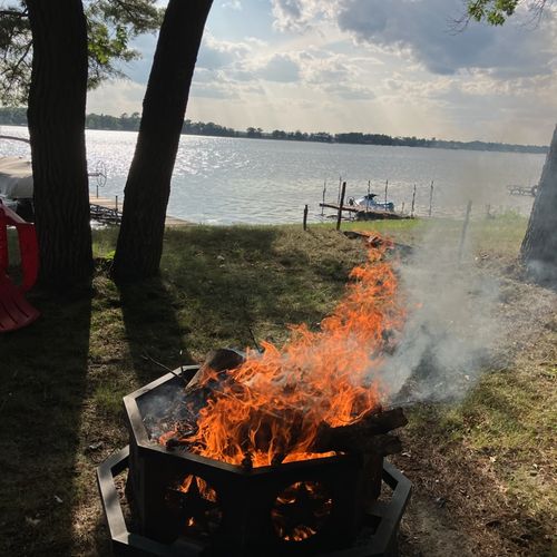 EXTERIOR:  Another view of the bonfire ring with Van Etten Lake in the background.