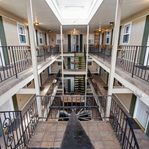 Classic New Orleans-style gallery walkway leading to your suite.