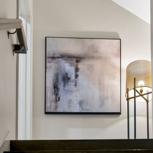 Abstract art and a woven lamp for calm vibes