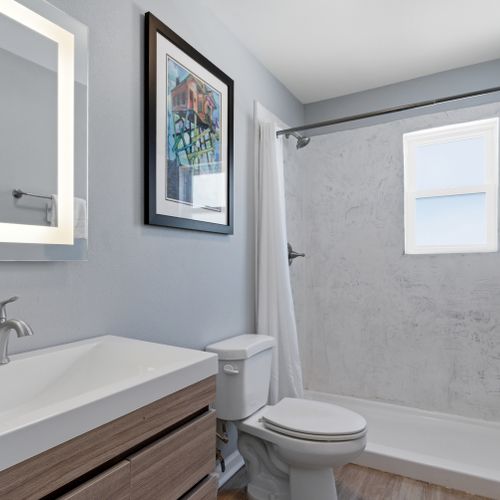 Fresh bathroom space stocked with essentials to refresh & unwind