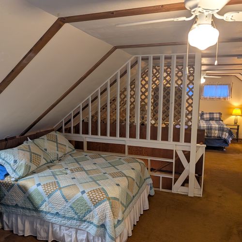 LOFT (SECOND FLOOR):  The home has a large upstairs open loft area that includes 3 full-size beds and a twin bed, thus sleeping up to 7 people in the loft area.
