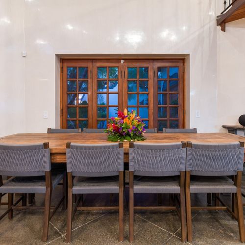 Live-edge dining for 10 - French doors to the garden, set for chef-led dinners.