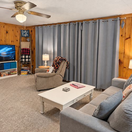 OVERVIEW:  The home has a comfy and relaxing living room with a sofa, chair coffee table, and television.  (Note that the wood fireplace in the living room is not available for guest usage.)