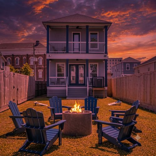 Two-story blue home w/ a backyard perfect for fireside hangs & sunny afternoons.