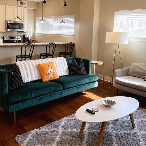 Bright living room w/ velvet seating & dining area