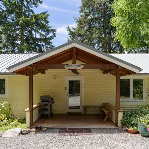Nestled among mature trees with a spacious private driveway, North Beach Cottage offers the perfect blend of privacy and convenience.