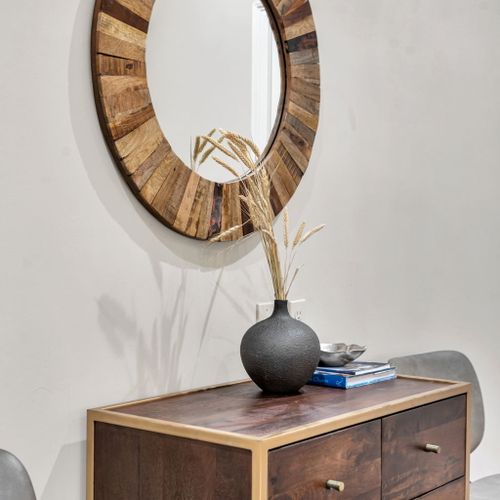 Sunburst wood mirror with an artful touch