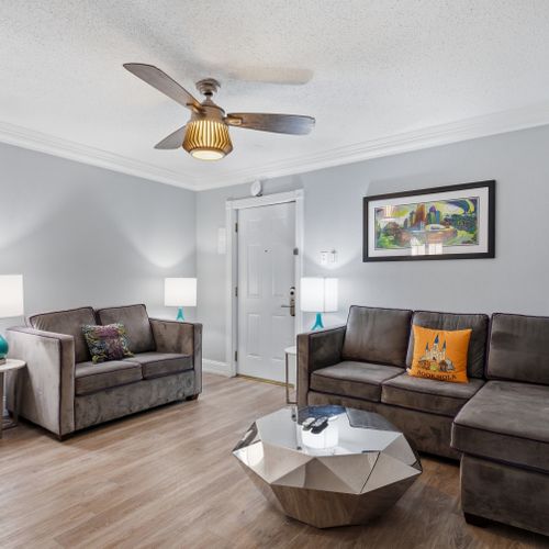 Cozy living nook w/ soft sofa seating, ideal for unwinding after a day out.
