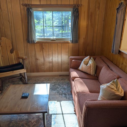LIVING ROOM:  Cute and cozy living room with a sofa, coffee table, chairs, and a ceiling fan.