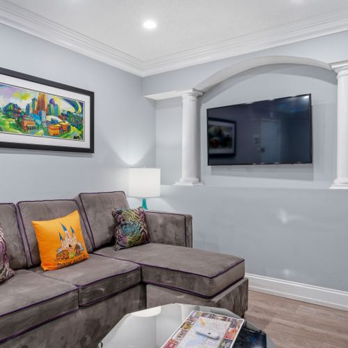 Cozy lounge corner w/ bold accents — made for movie nights in.