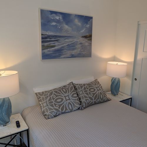 LIVING SPACE: The comfy full-size bed with a closet and smart TV. Perfect for relaxation!
