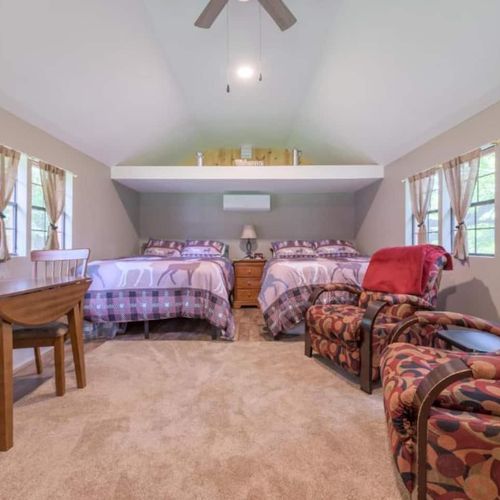 CABIN #2:  Cute little woodsy log cabin with 2 queen-size beds.  Mini-split unit included for heat and A/C.
