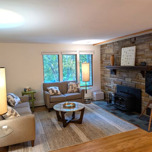 LIVING ROOM #2 (SECOND FLOOR):  Features a sofa, loveseat, coffee table, and television.  (Note that the wood fireplace is not available for guest usage.)