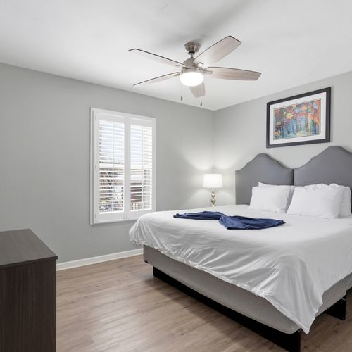 Unit 307 – Secondary king bedroom w/ soft tones & a peaceful atmosphere.