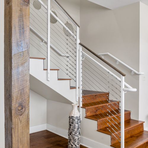Sleek modern staircase with white railings