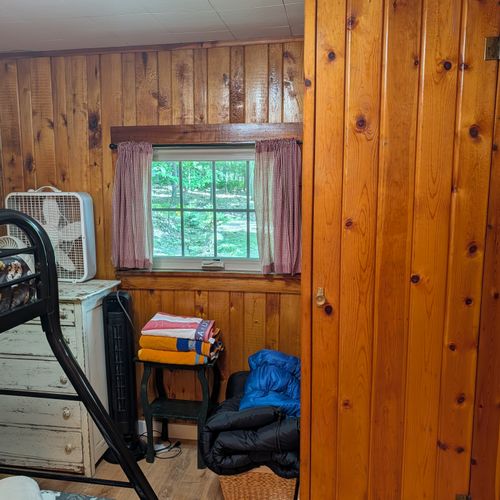 BEDROOM #2: Includes a twin on full bunk bed, a dresser, and a mirror.