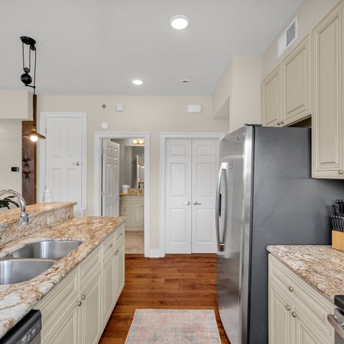 Kitchen flowing to the hallway and closets