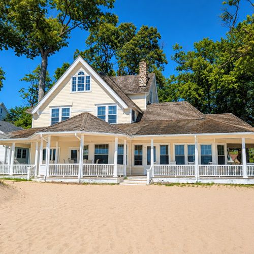 OVERVIEW:  The back of the house, which faces Lake Michigan and has incredible views of Lake Michigan and the Frankfort Lighthouse