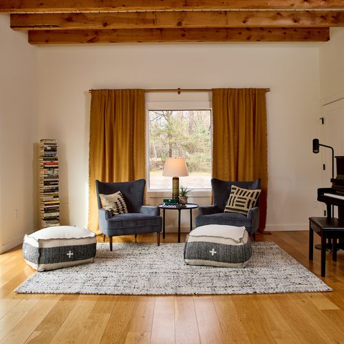 Looking into the music room in the main house, with oversized sliding glass doors to the left that allow you to step out onto the deck.
