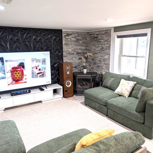 RECREATION ROOM (LOWER LEVEL):  The home has a very cute and fun recreation room in the lower level that is complete with a wet bar, mini fridge, huge television, and karaoke enabled amplifier with two mics.