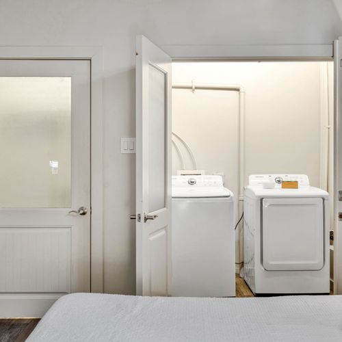 Full-size washer and dryer in their own room
