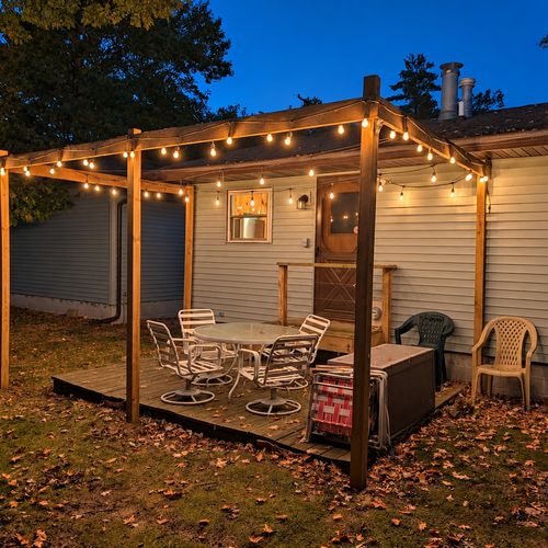 EXTERIOR:  The backyard deck at night