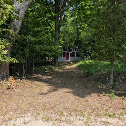 EXTERIOR: The view of the primary driveway up to the property