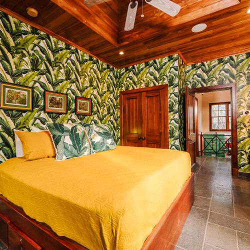 Spacious master suite with king size bed and stylish tropical design at a luxury Playa Langosta vacation rental in Tamarindo, Costa Rica. Comfortable private retreat perfect for relaxing coastal getaways and premium vacation stays.