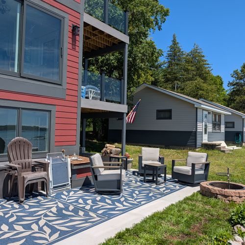 EXTERIOR: The beautiful backyard with lake access to the pristine Crystal Lake. Plenty of seating, a firepit, and kayaks for guest use and enjoyment!