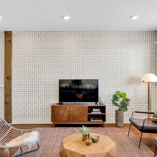 Smart TV framed by statement wallpaper