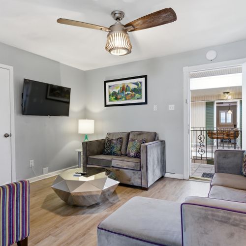 Sun-filled living area w/ a warm, inviting feel to relax & recharge.