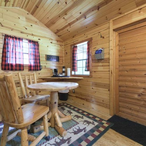 CABIN #1:  Cute little woodsy log cabin with a queen-size bed.  Mini-split unit included for heat and A/C.