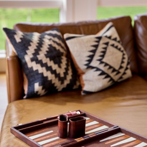 There's no shortage of games on sight, and what better place to play than the main house living room, where you can take in the views with windows on all sides.