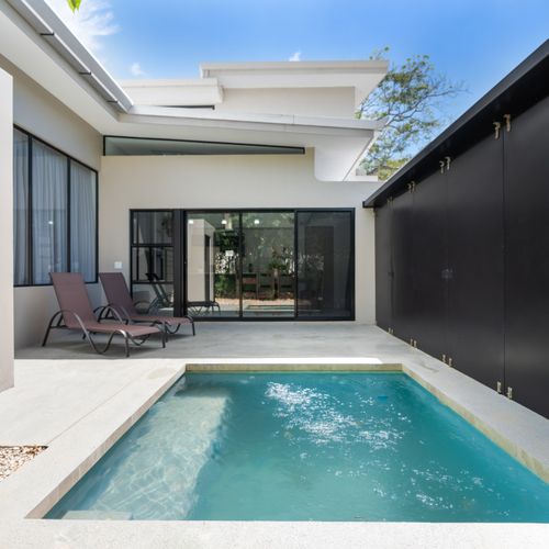 Pool area with sun loungers