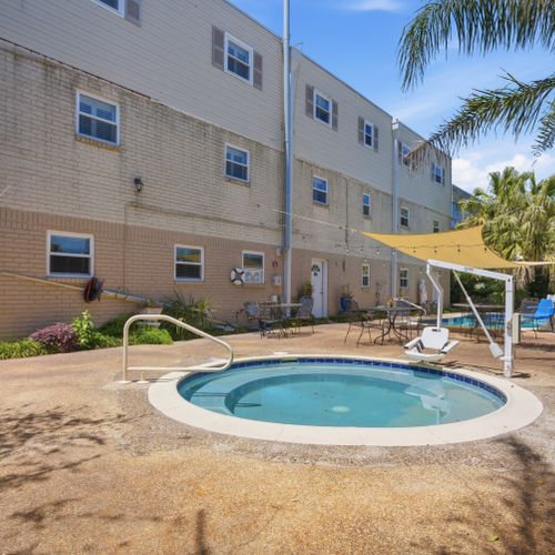 Soak in the bubbling hot tub just steps from the pool.