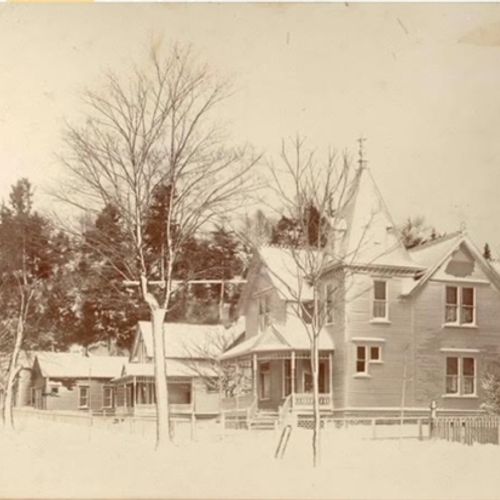 EXTERIOR: A historic and aged photo of the property